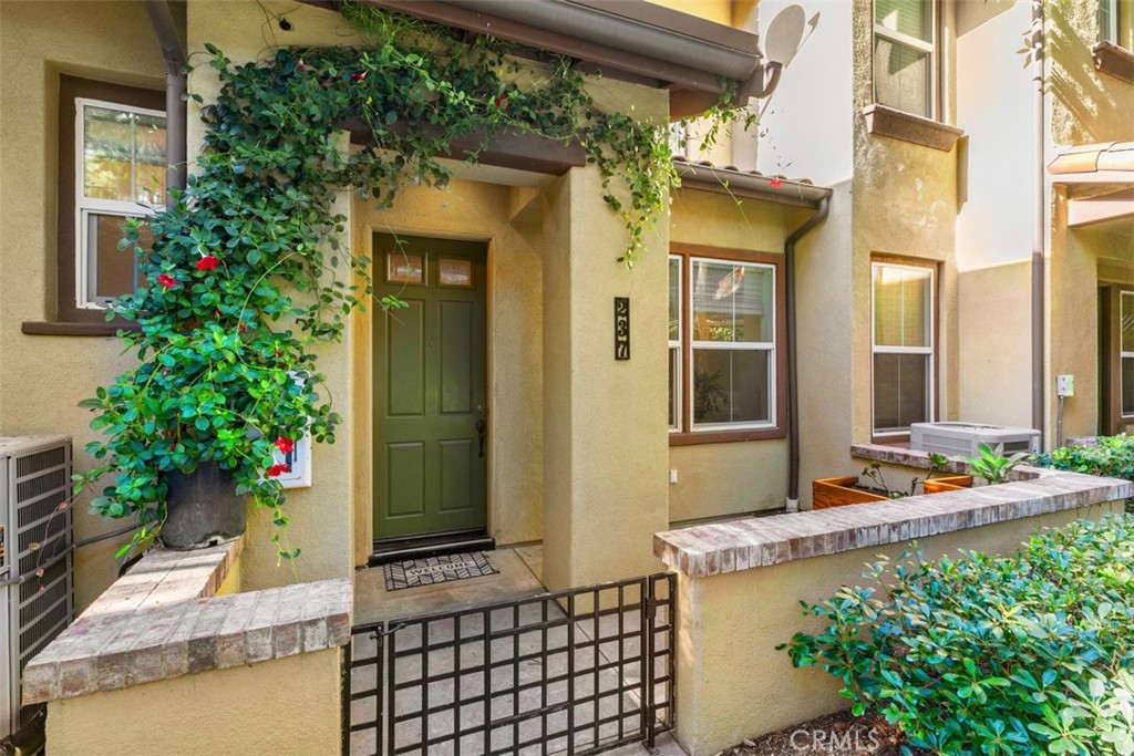 a front view of a house with outdoor seating
