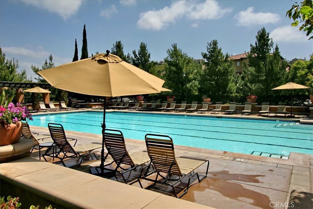 237 Coral Rose Irvine, CA 92603 - Photo 2 of 6 an outdoor space with furniture and umbrella