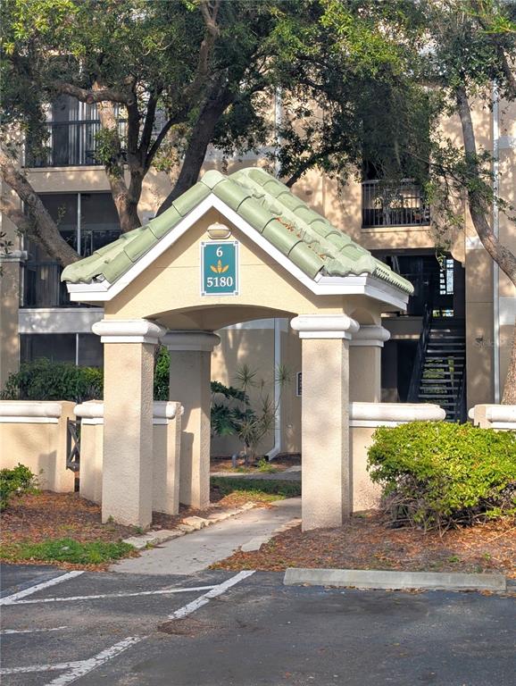 a front view of a house with a yard garage and outdoor seating