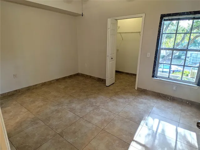 a bathroom with a granite countertop sink toilet mirror and shower