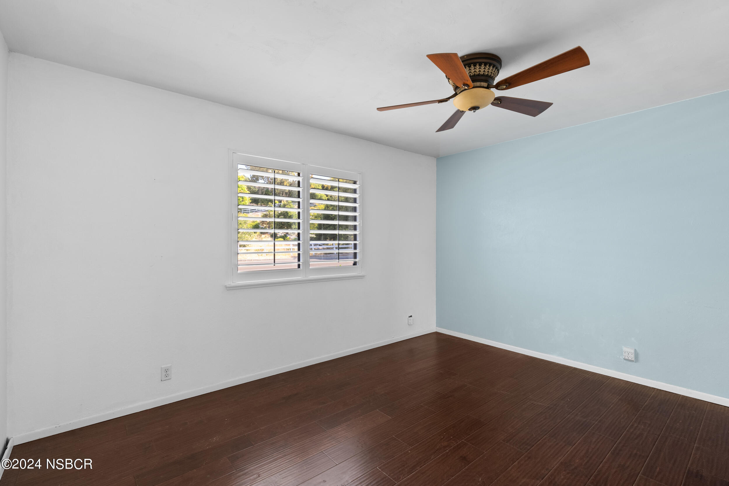 1113 James Way Arroyo Grande, CA 93420 - Photo 15 of 30 an empty room with wooden floor fan and windows