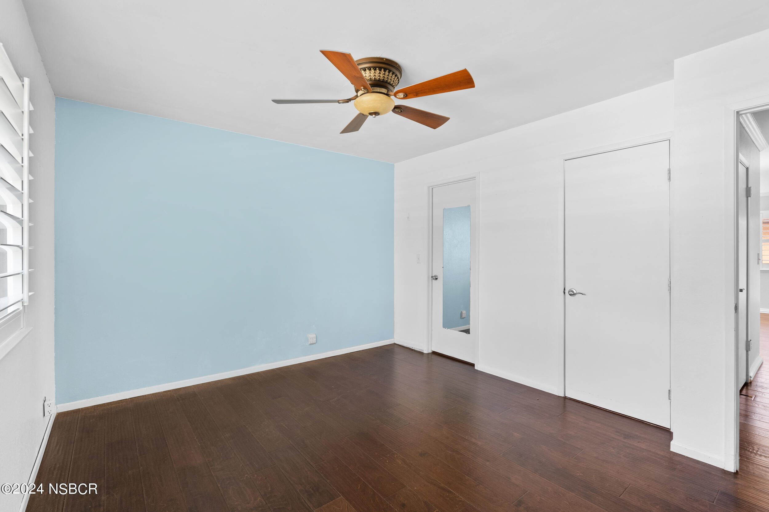 1113 James Way Arroyo Grande, CA 93420 - Photo 16 of 30 a view of wooden floor and a chandelier fan in a room