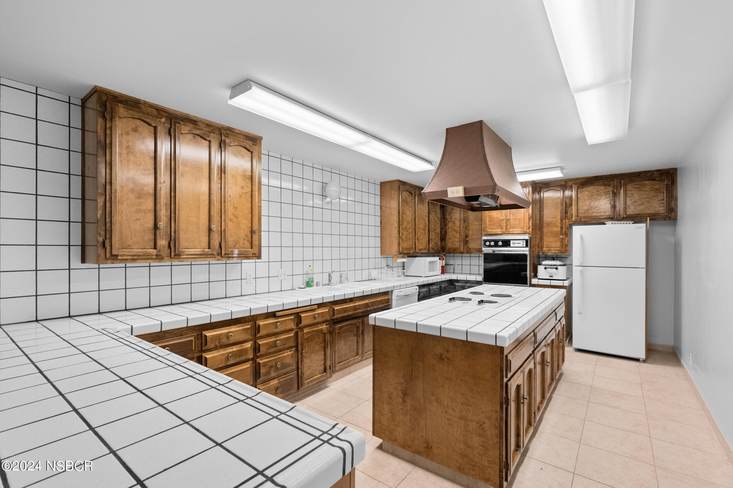 1113 James Way Arroyo Grande, CA 93420 - Photo 25 of 30 a kitchen that has a sink a stove and a refrigerator