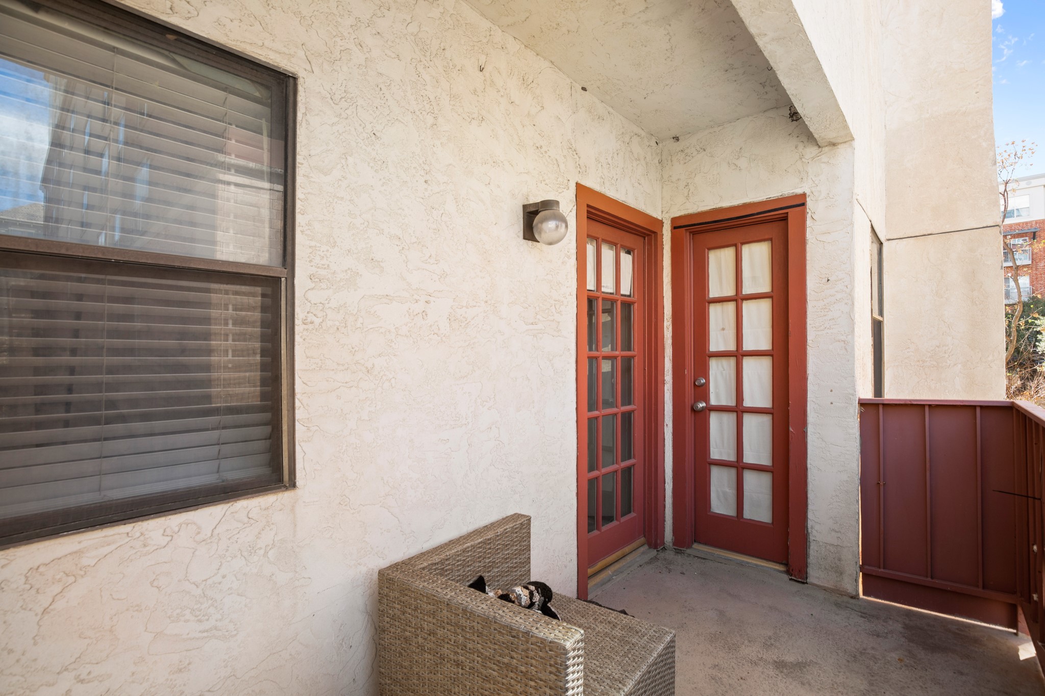 706 West 22nd Street, Unit 206 Austin, TX 78705 - Photo 14 of 18 Doorway to property featuring stucco siding