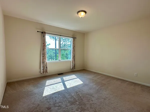 a spacious bathroom with a double vanity sink and a mirror