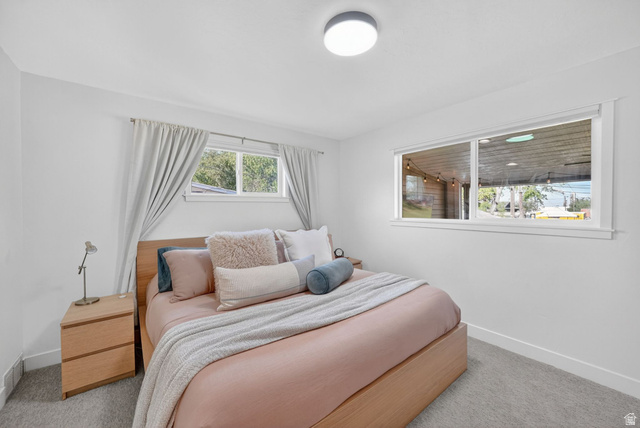 66 South 425 West Bountiful, UT 84010 - Photo 12 of 25 Bright room featuring white walls and a contemporary flush-mount ceiling light