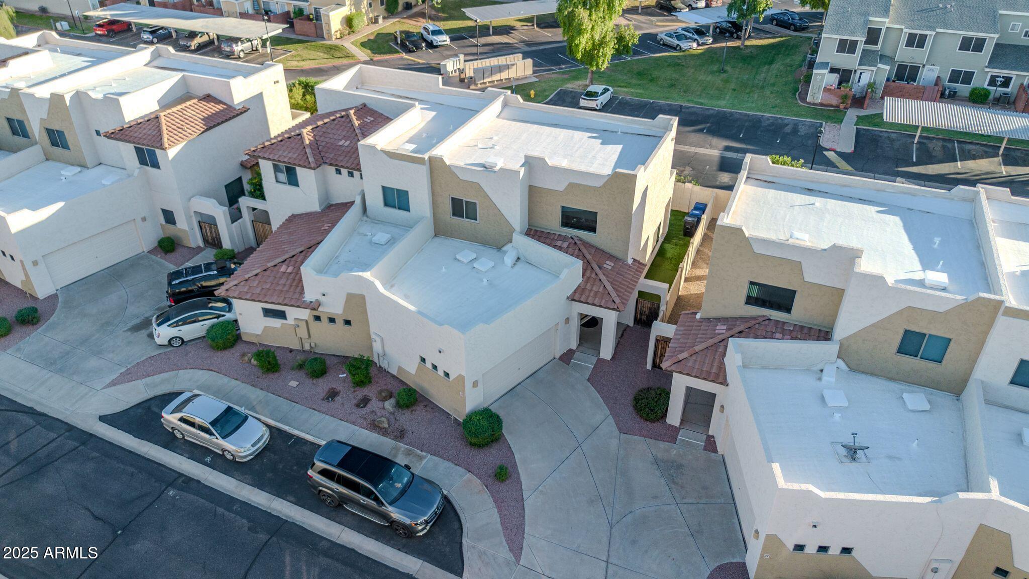 an aerial view of a house with outdoor space
