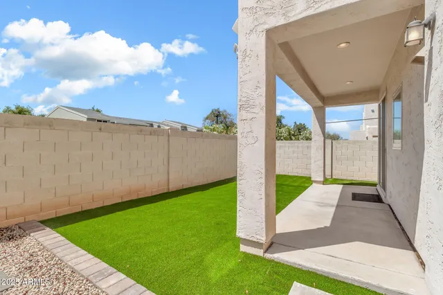 a view of a street with a palm tree