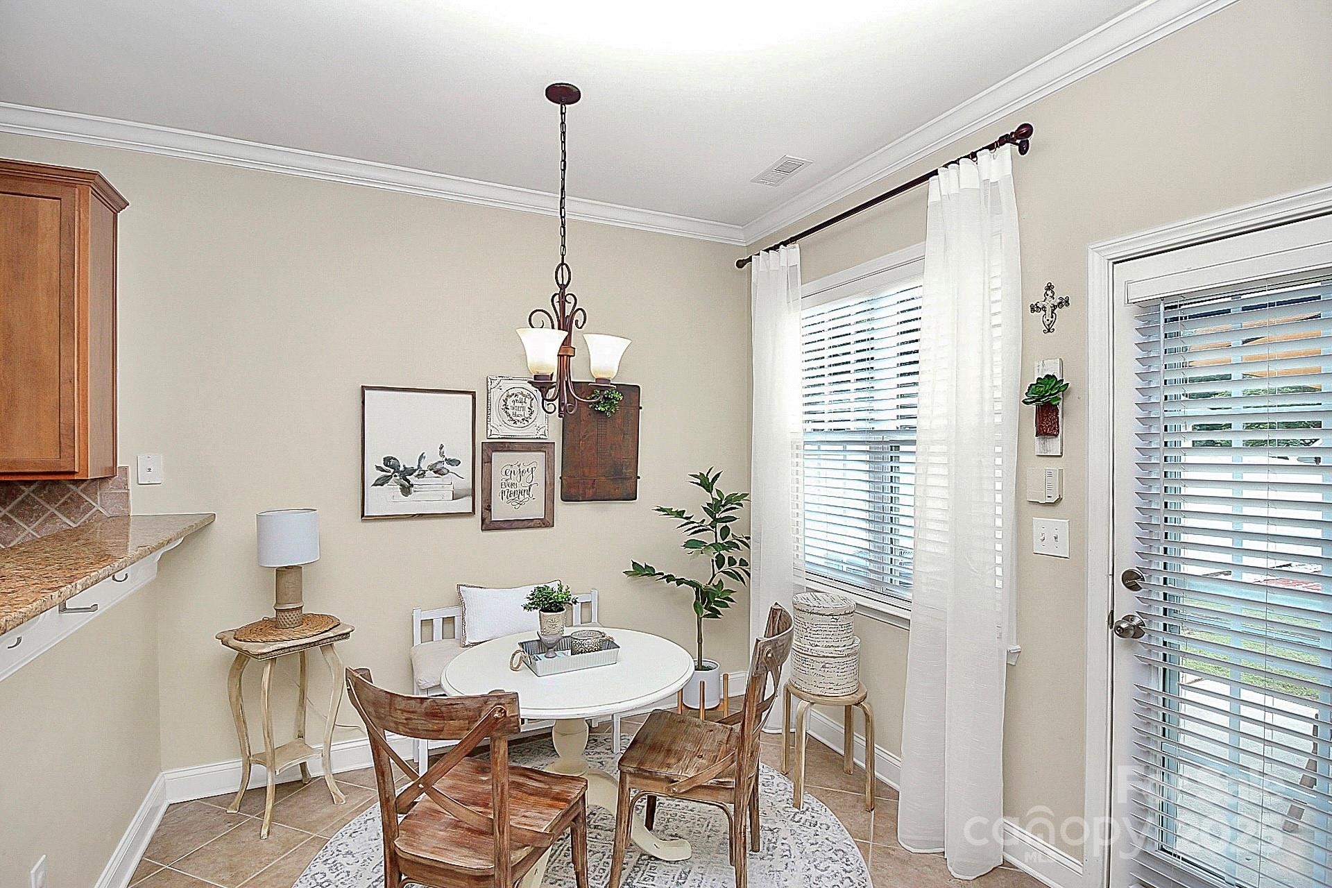 10008 Caldwell Depot Road Cornelius, NC 28031 - Photo 12 of 33 a view of a dining room with furniture and window