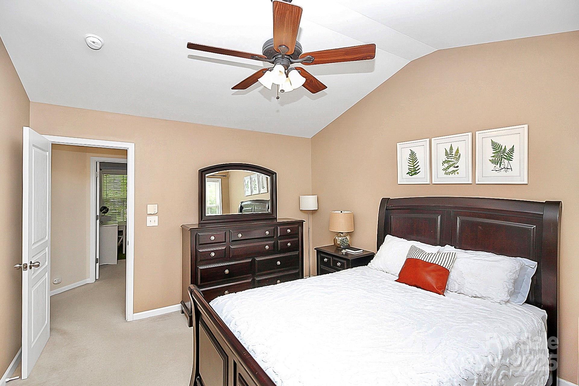 10008 Caldwell Depot Road Cornelius, NC 28031 - Photo 18 of 33 a bedroom with a bed and a dresser