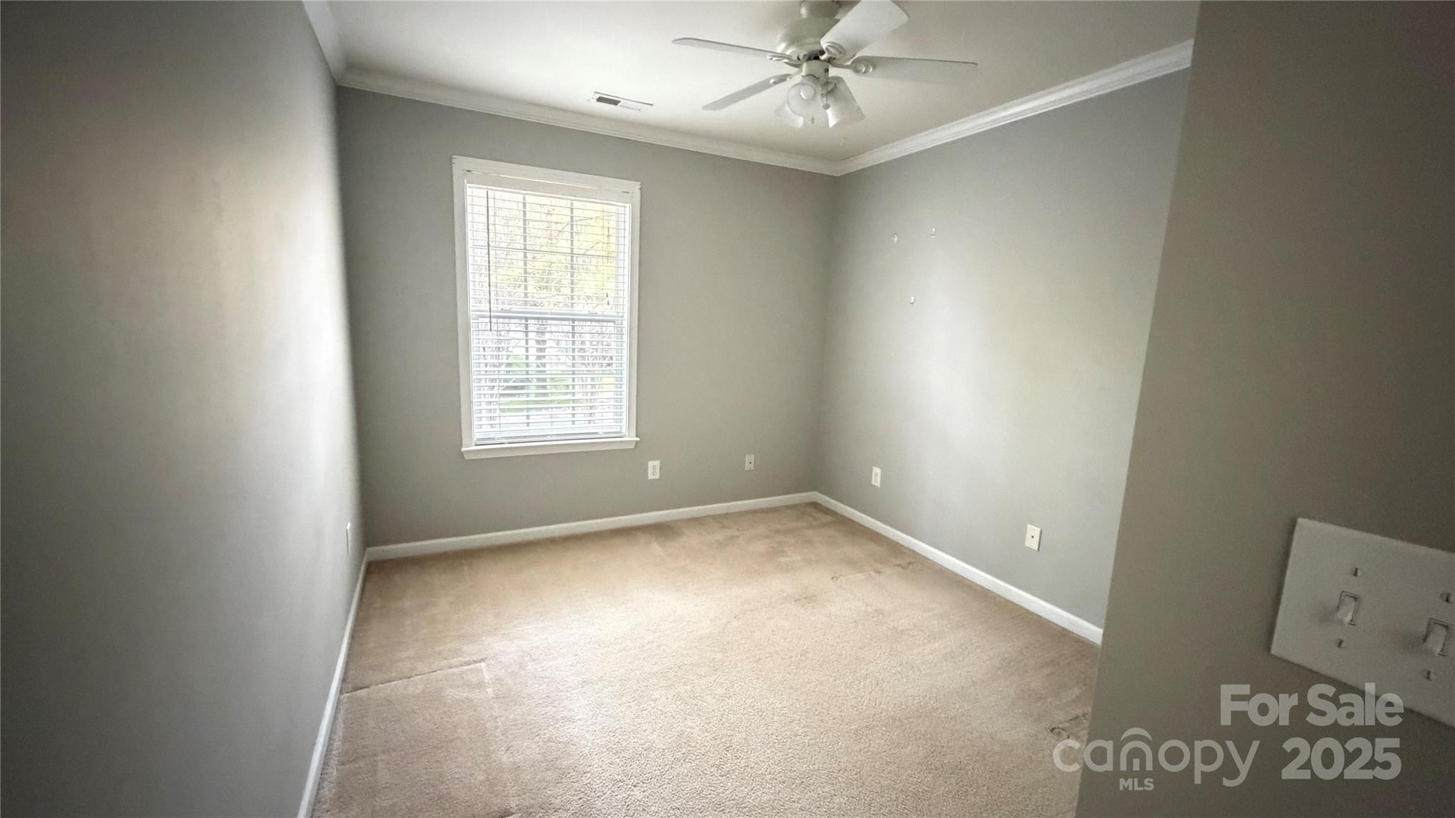 10008 Caldwell Depot Road Cornelius, NC 28031 - Photo 29 of 33 an empty room with windows and fan