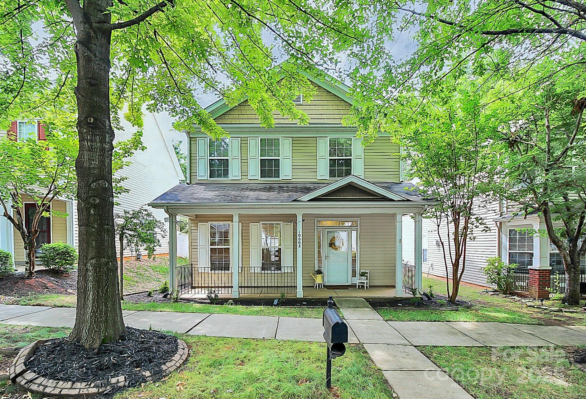 10008 Caldwell Depot Road Cornelius, NC 28031 - Photo 3 of 33 a front view of a house with a yard