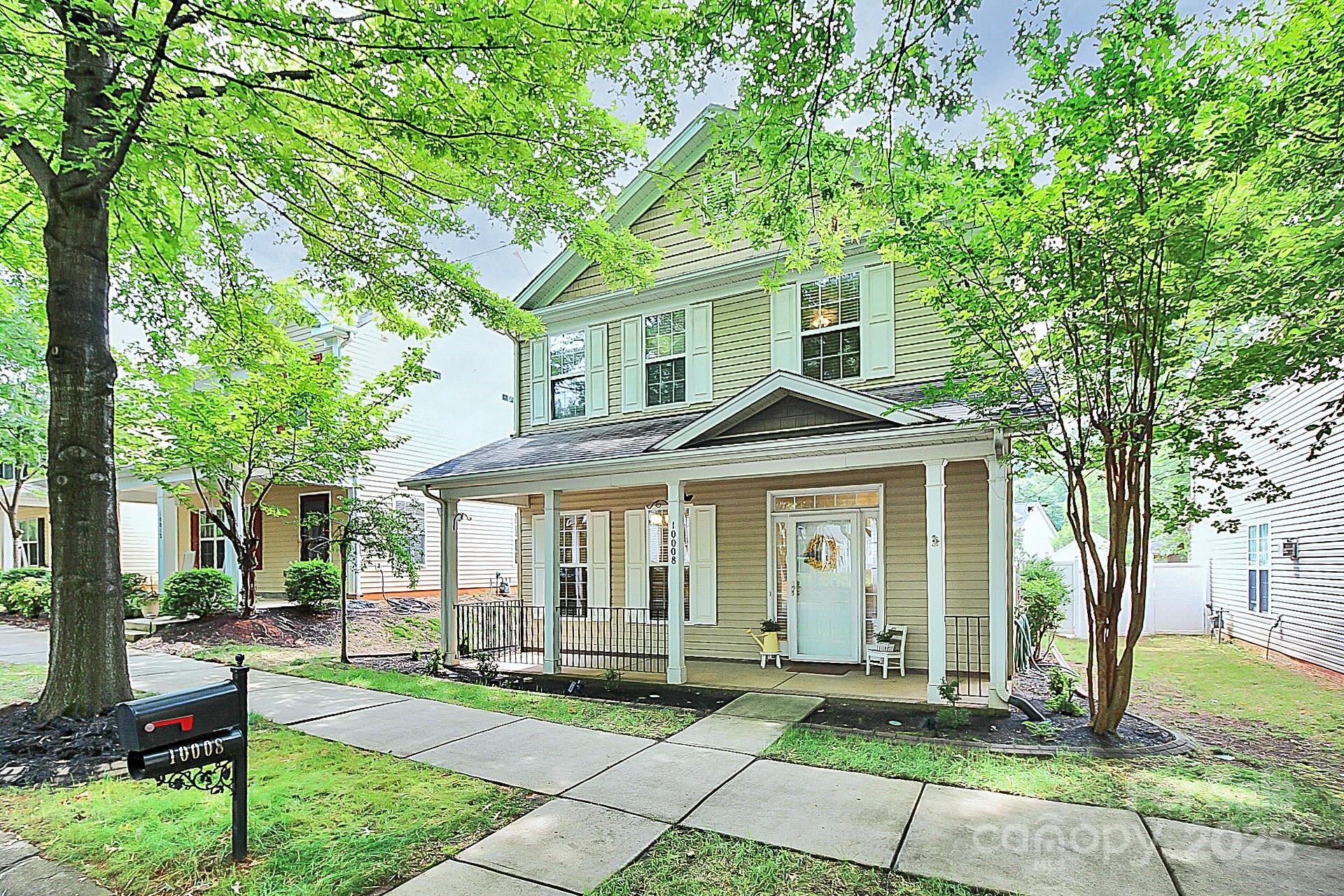 10008 Caldwell Depot Road Cornelius, NC 28031 - Photo 31 of 33 a front view of a house with a garden