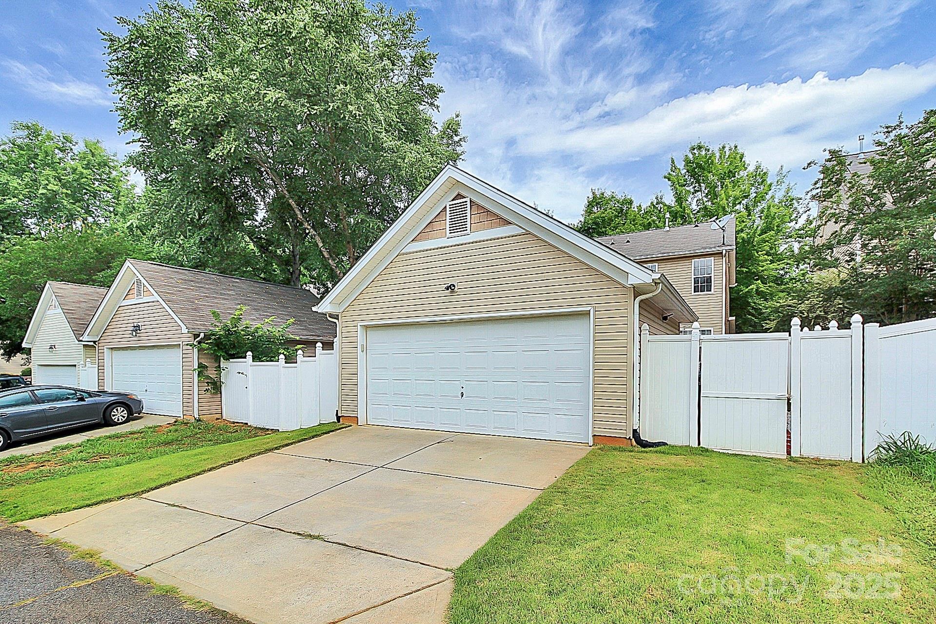 10008 Caldwell Depot Road Cornelius, NC 28031 - Photo 33 of 33 a view of garage yard and front view of a house