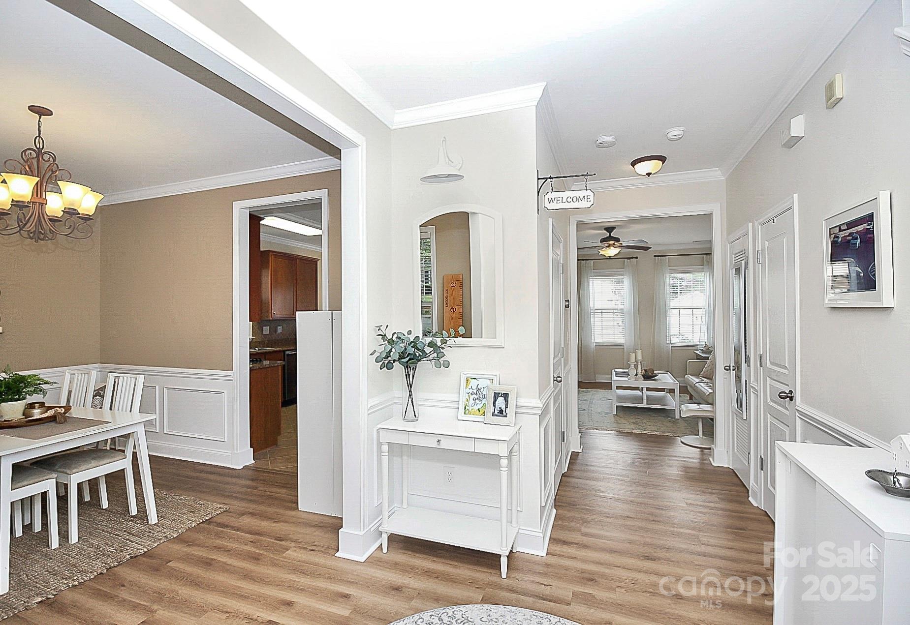 10008 Caldwell Depot Road Cornelius, NC 28031 - Photo 6 of 33 a view of a dining room with furniture wooden floor and a chandelier
