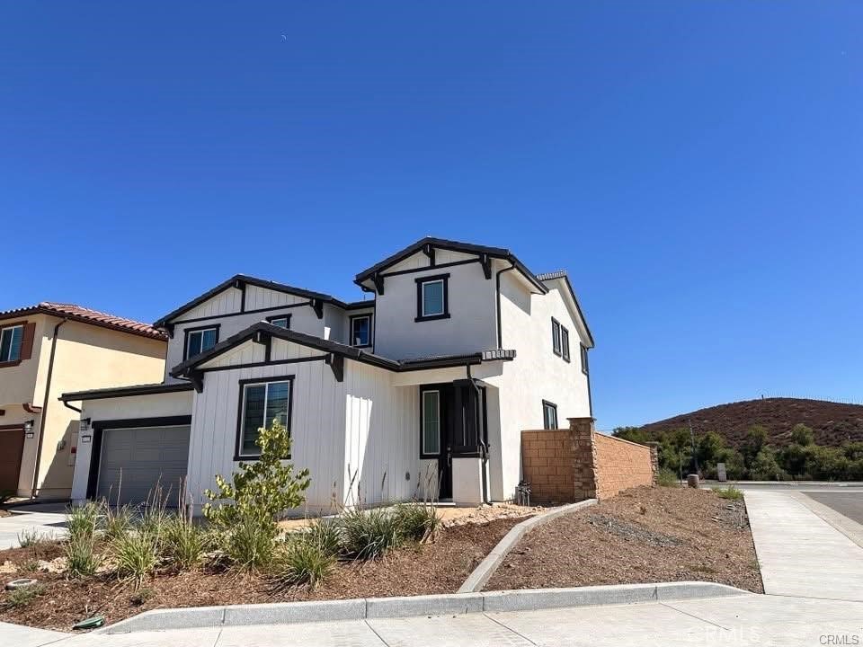 33305 Rusty Court Winchester, CA 92596 - Photo 1 of 1 a front view of a house with a yard