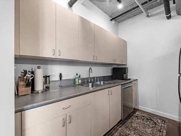 a kitchen with a sink and cabinets