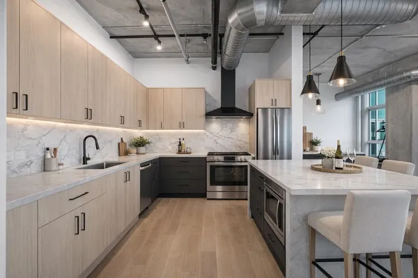 a kitchen with a sink stove and cabinets