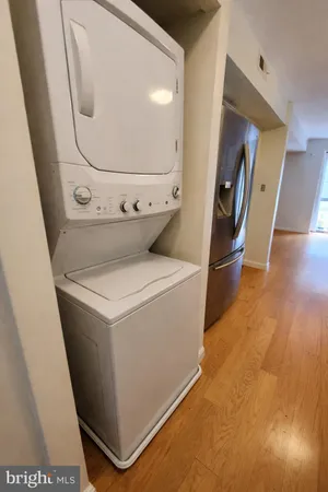 a spacious bedroom with a bed and a table in it