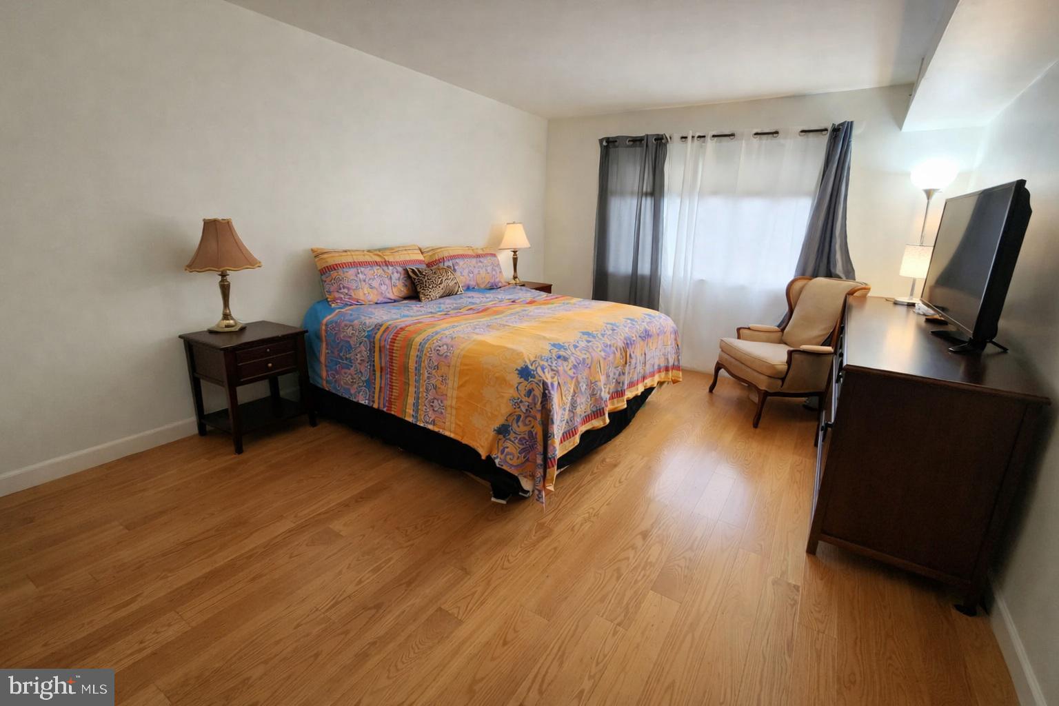 2010 Colts Neck Road, Unit 2B Reston, VA 20191 - Photo 9 of 13 a bed room with a bed window and a chair