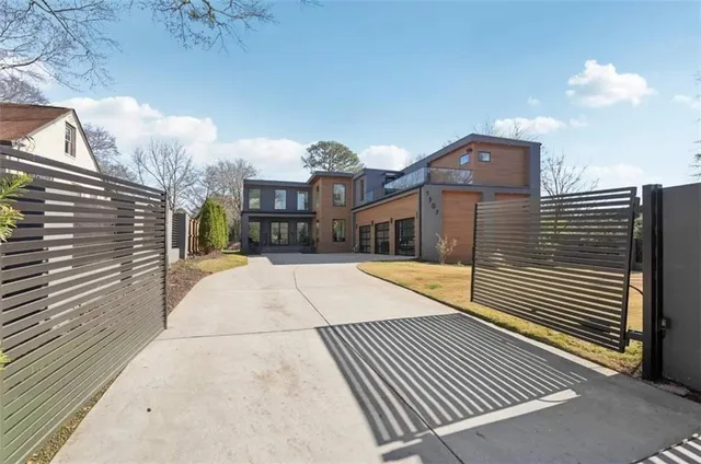 a view of a brick building next to a yard