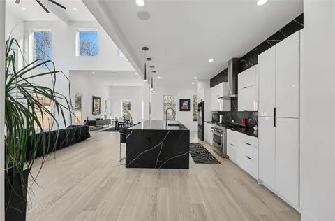 a bathroom with a shower sink and mirror
