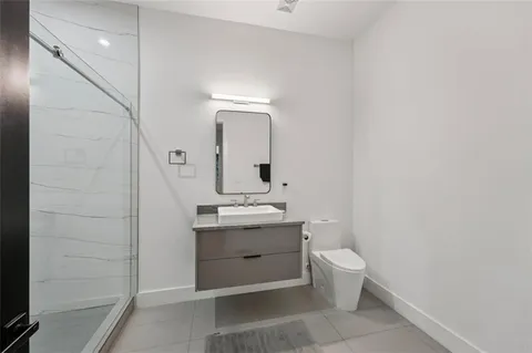 a kitchen with granite countertop a sink and cabinets