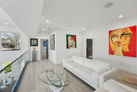 a view of a house with a yard and pathway