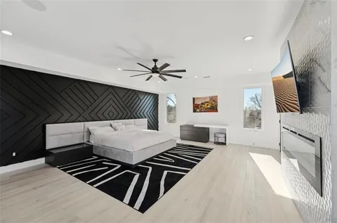 a view of swimming pool with a lounge chairs