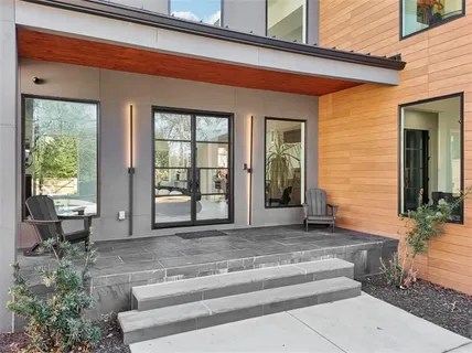 a living room with furniture and flat screen tv