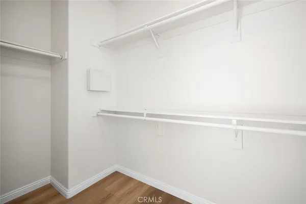 a bathroom with a granite countertop sink a mirror and a shower