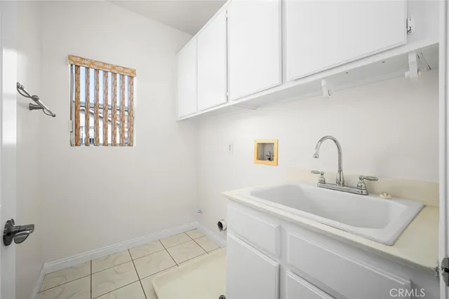 a bathroom with a tub a window and a shower