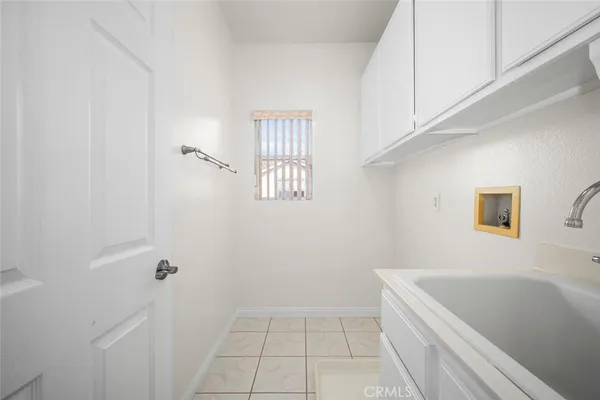 an empty room with wooden floor