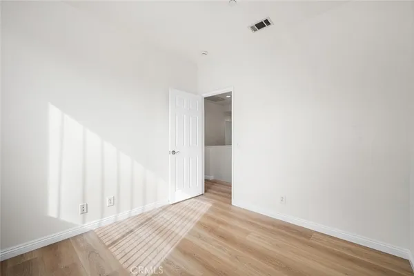 a bathroom with a double vanity sink mirror and toilet