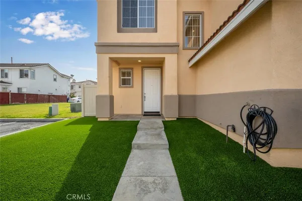 front view of a house with a yard