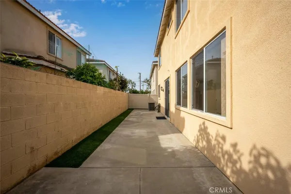 a balcony with table and chairs