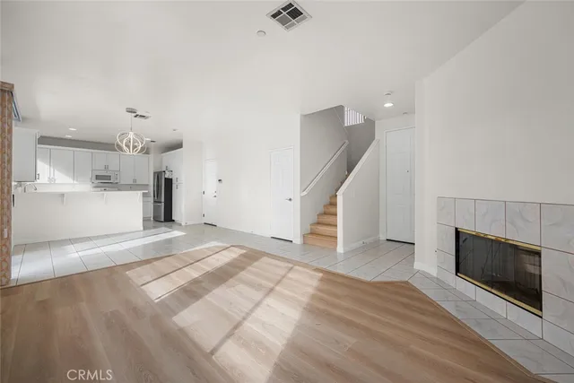 a view of an empty room and a window