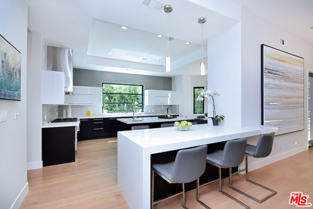 14520 Greenleaf Street Sherman Oaks, CA 91403 - Photo 11 of 54 a kitchen with a sink cabinets and window