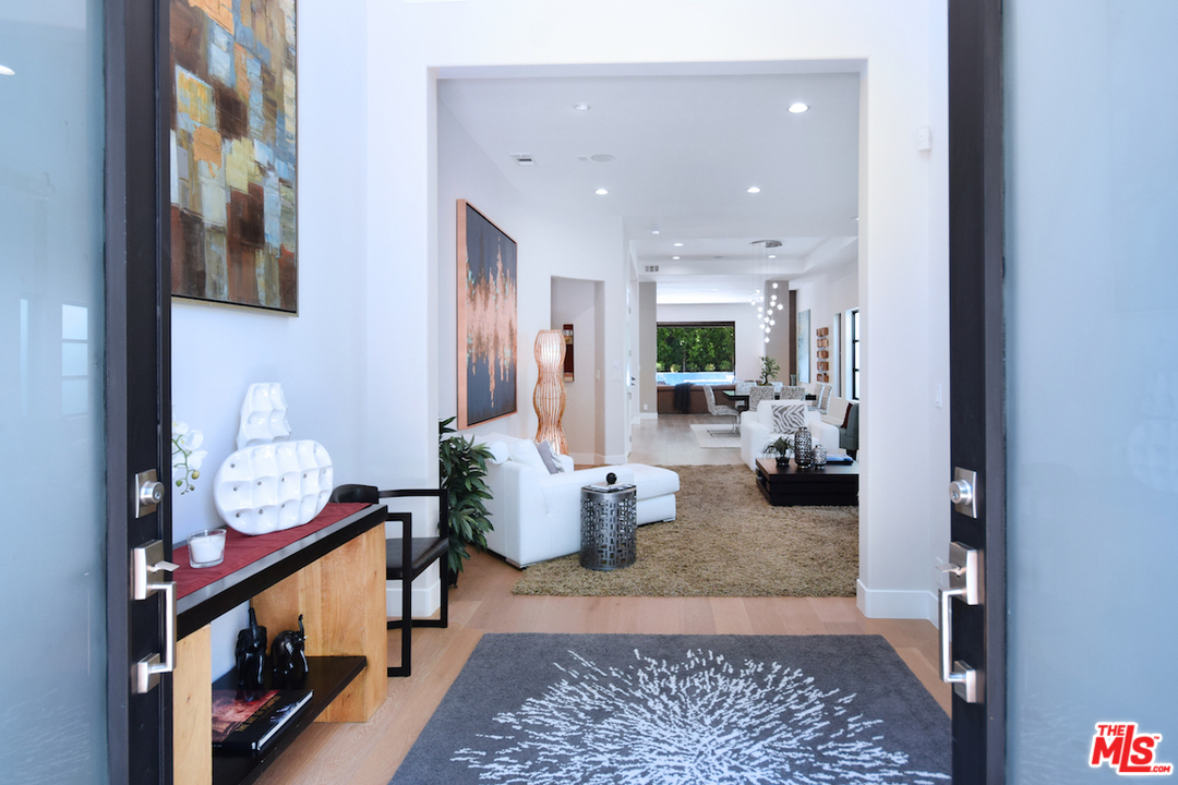 14520 Greenleaf Street Sherman Oaks, CA 91403 - Photo 13 of 54 a living room with furniture and a table