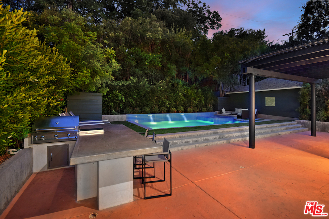 14520 Greenleaf Street Sherman Oaks, CA 91403 - Photo 23 of 54 a view of a backyard with swimming pool