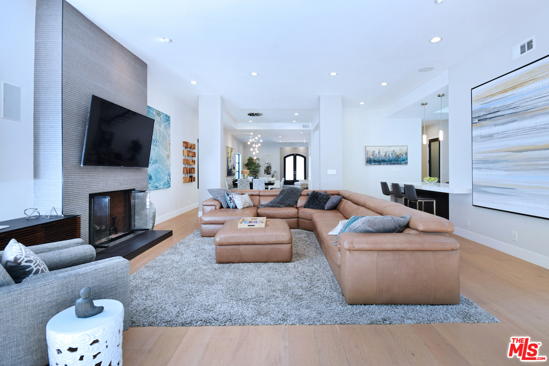 14520 Greenleaf Street Sherman Oaks, CA 91403 - Photo 27 of 54 a living room with fireplace furniture and a flat screen tv