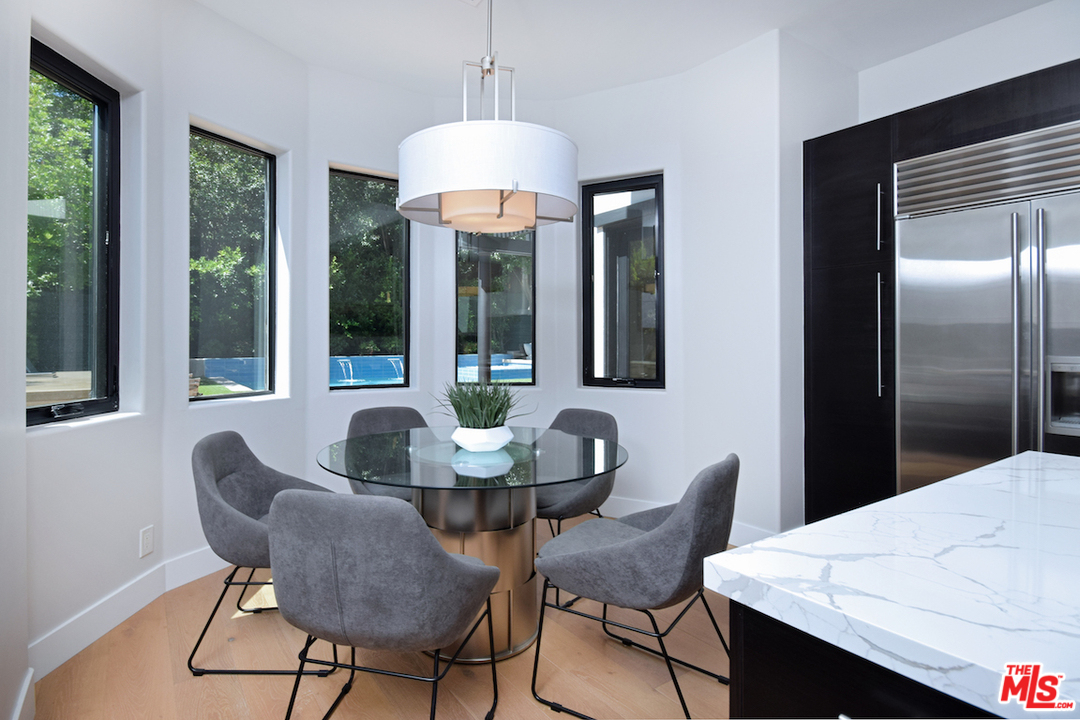 14520 Greenleaf Street Sherman Oaks, CA 91403 - Photo 32 of 54 a dining room with furniture a chandelier and window