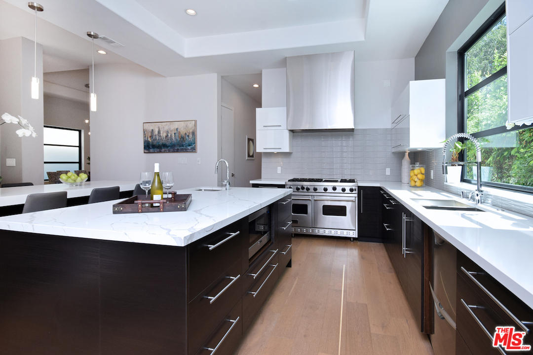 14520 Greenleaf Street Sherman Oaks, CA 91403 - Photo 34 of 54 a kitchen with a sink appliances and cabinets