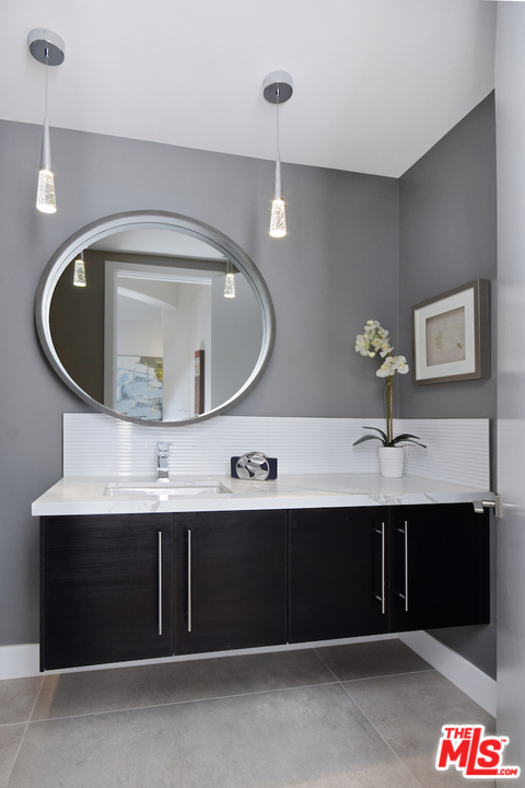 14520 Greenleaf Street Sherman Oaks, CA 91403 - Photo 36 of 54 a bathroom with a sink and a mirror
