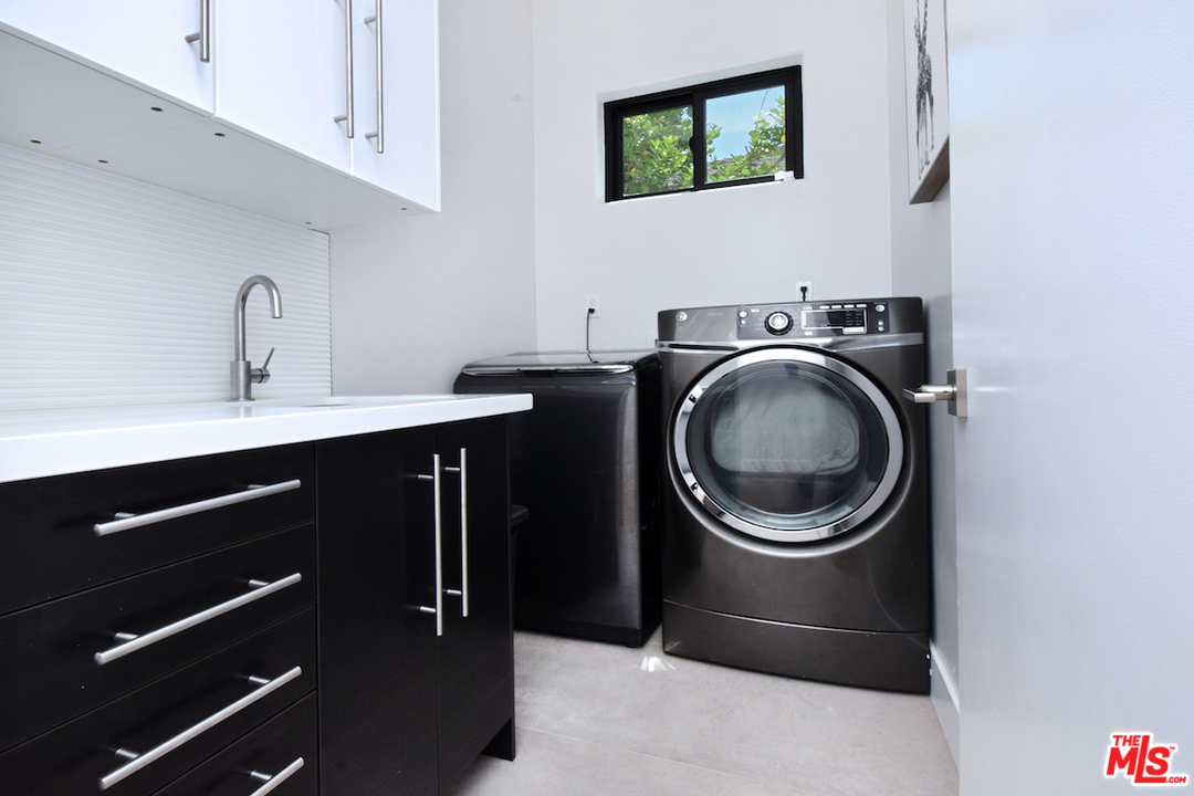 14520 Greenleaf Street Sherman Oaks, CA 91403 - Photo 39 of 54 a utility room with sink dryer and washer