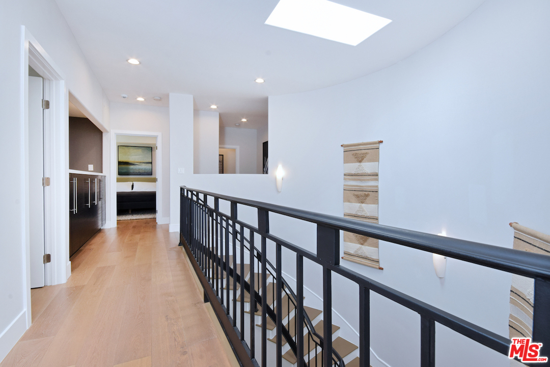 14520 Greenleaf Street Sherman Oaks, CA 91403 - Photo 42 of 54 a view of a hallway with wooden floor and staircase