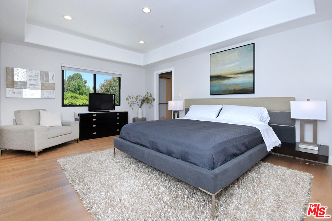 14520 Greenleaf Street Sherman Oaks, CA 91403 - Photo 43 of 54 a spacious bedroom with a large bed and a couch