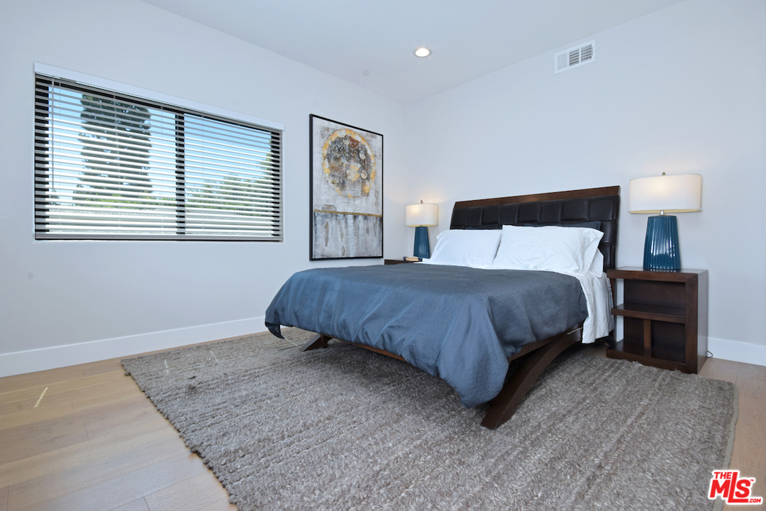 14520 Greenleaf Street Sherman Oaks, CA 91403 - Photo 45 of 54 a bedroom with a bed and a night stand