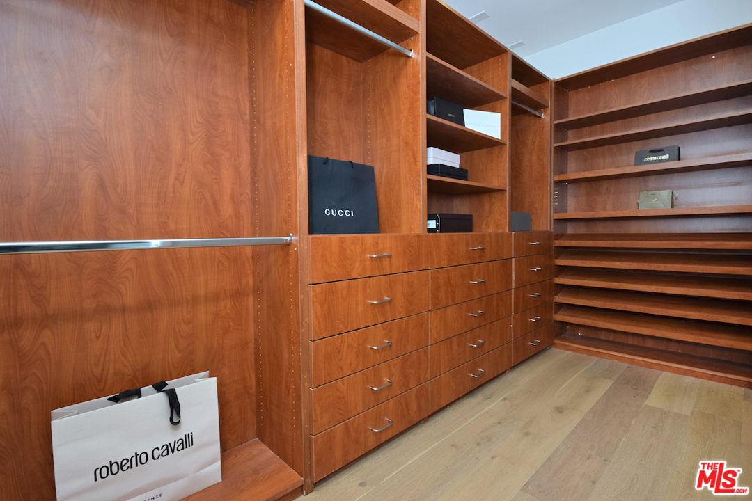 14520 Greenleaf Street Sherman Oaks, CA 91403 - Photo 47 of 54 a view of walk in closet with empty racks