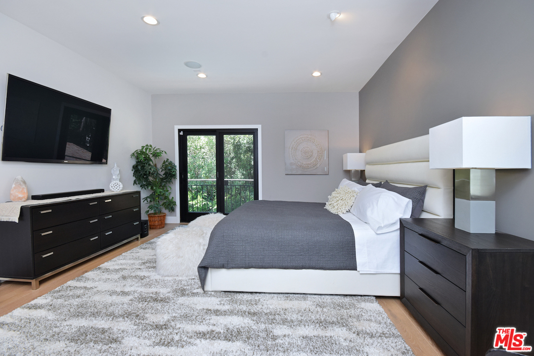 14520 Greenleaf Street Sherman Oaks, CA 91403 - Photo 51 of 54 a living room with a couch and a flat screen tv